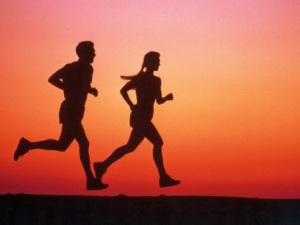couple running in sunset